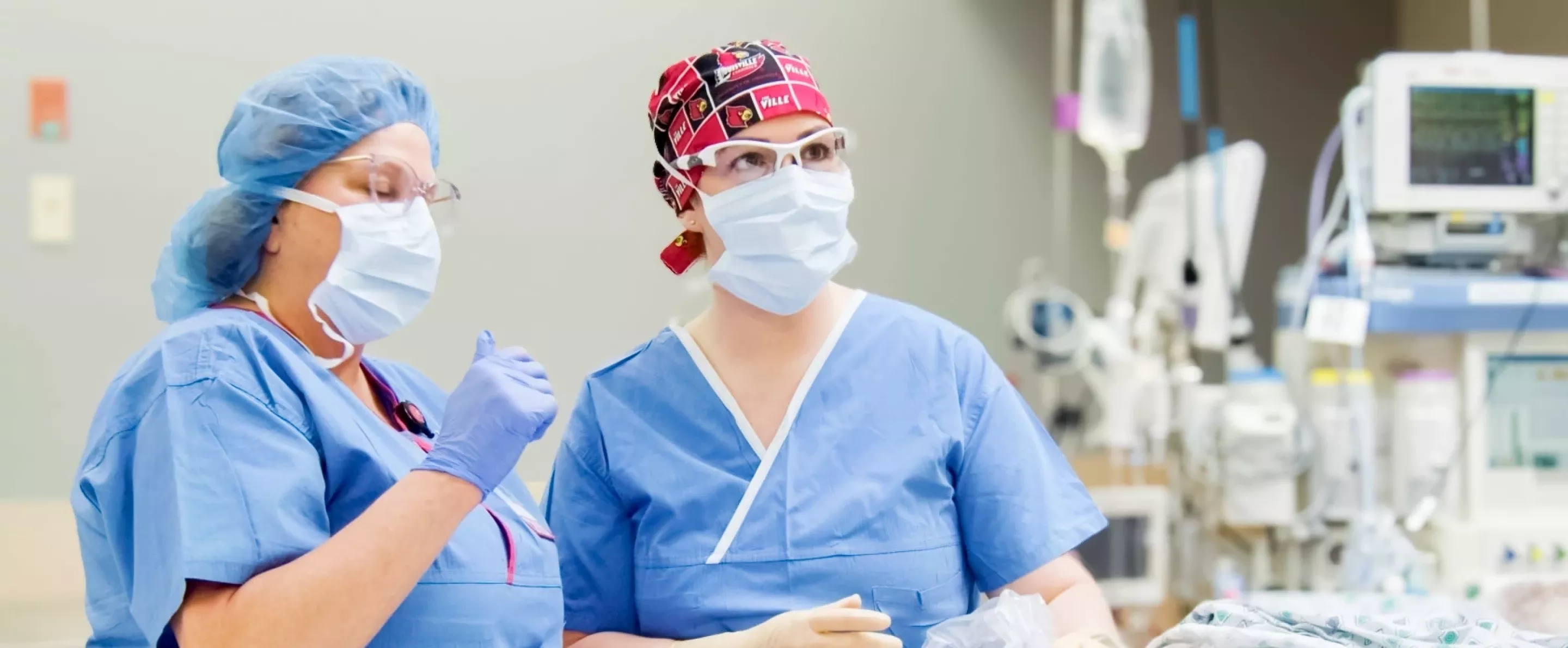 A resident in the Nurse Anesthesia Program receives instruction in the operating room from faculty member Dr. Jennifer-Harpe Bates.