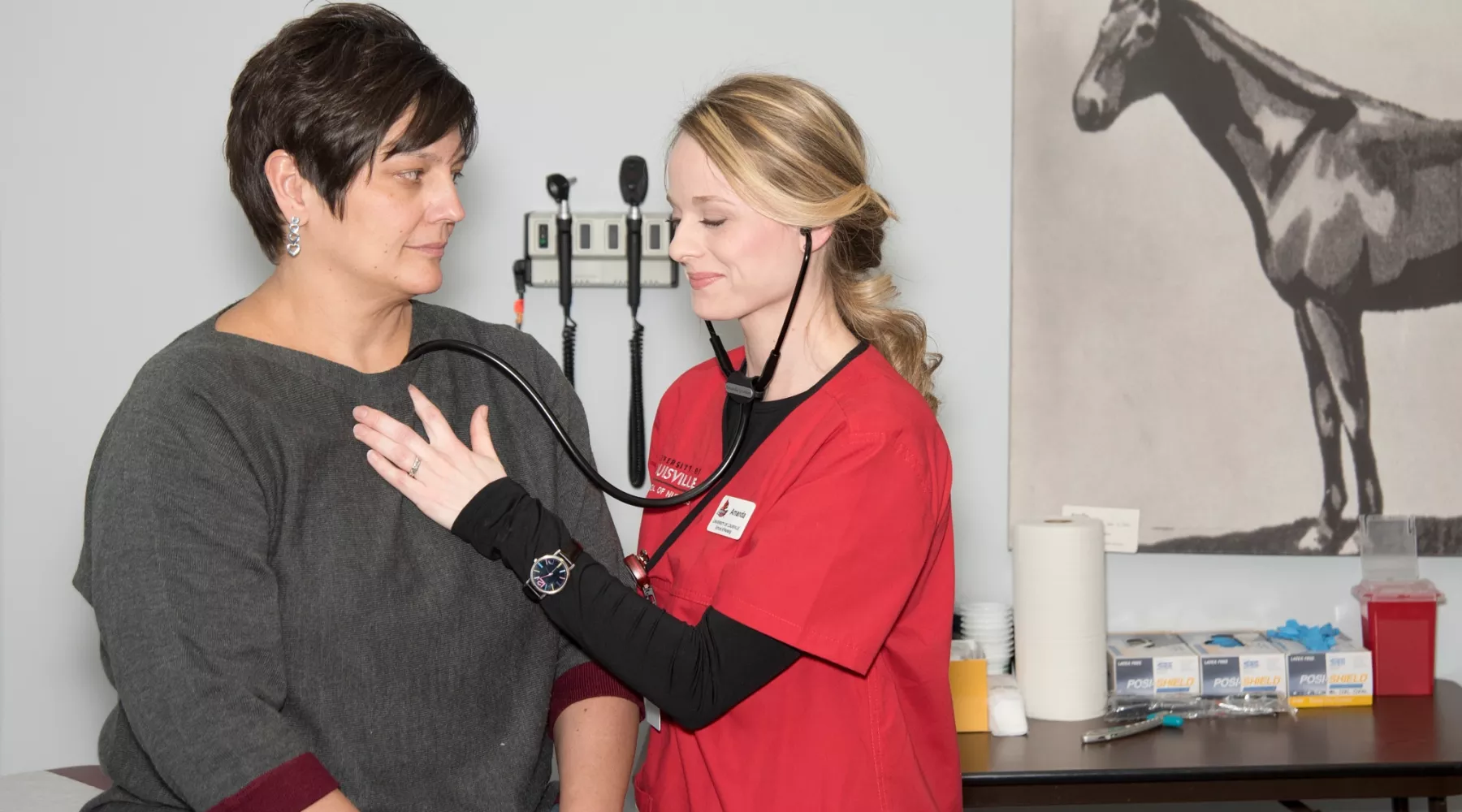 Nursing student examines a patient of the Racing Center