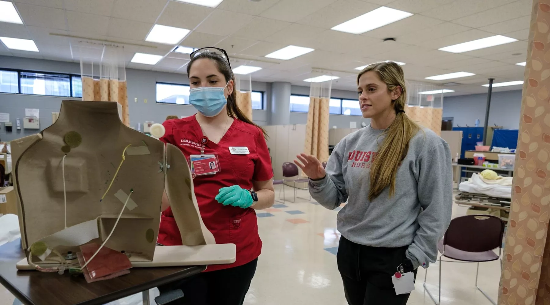 BSN students in skills lab practicing procedures