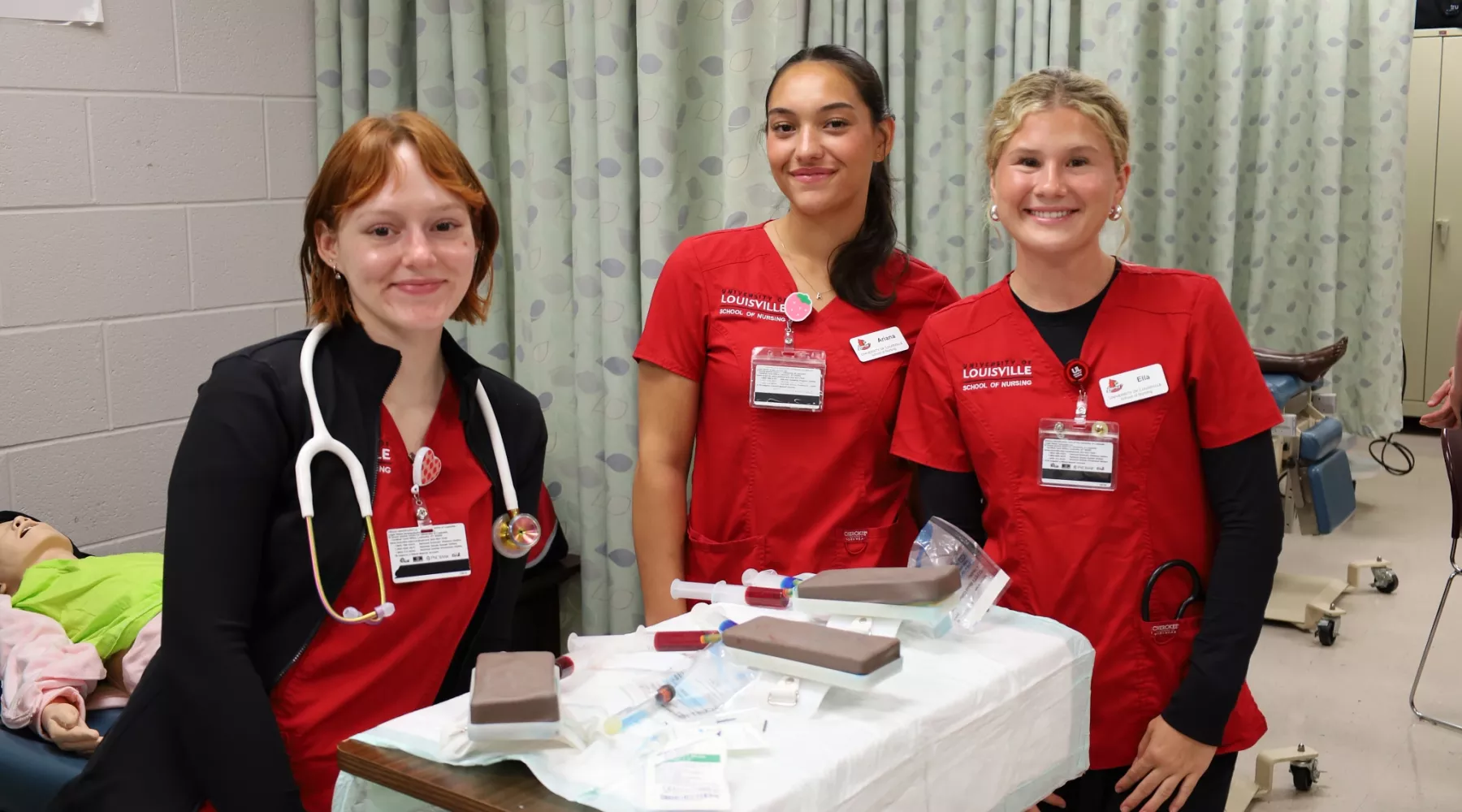 BSN students pause for a photo while conducting a clinical simulation.