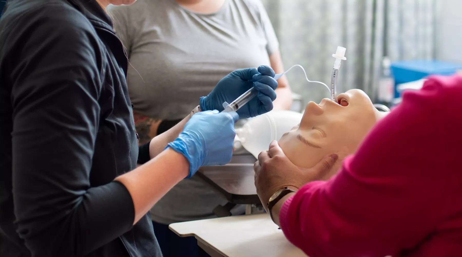 Adult Acute Care students practicing procedures in simulation lab