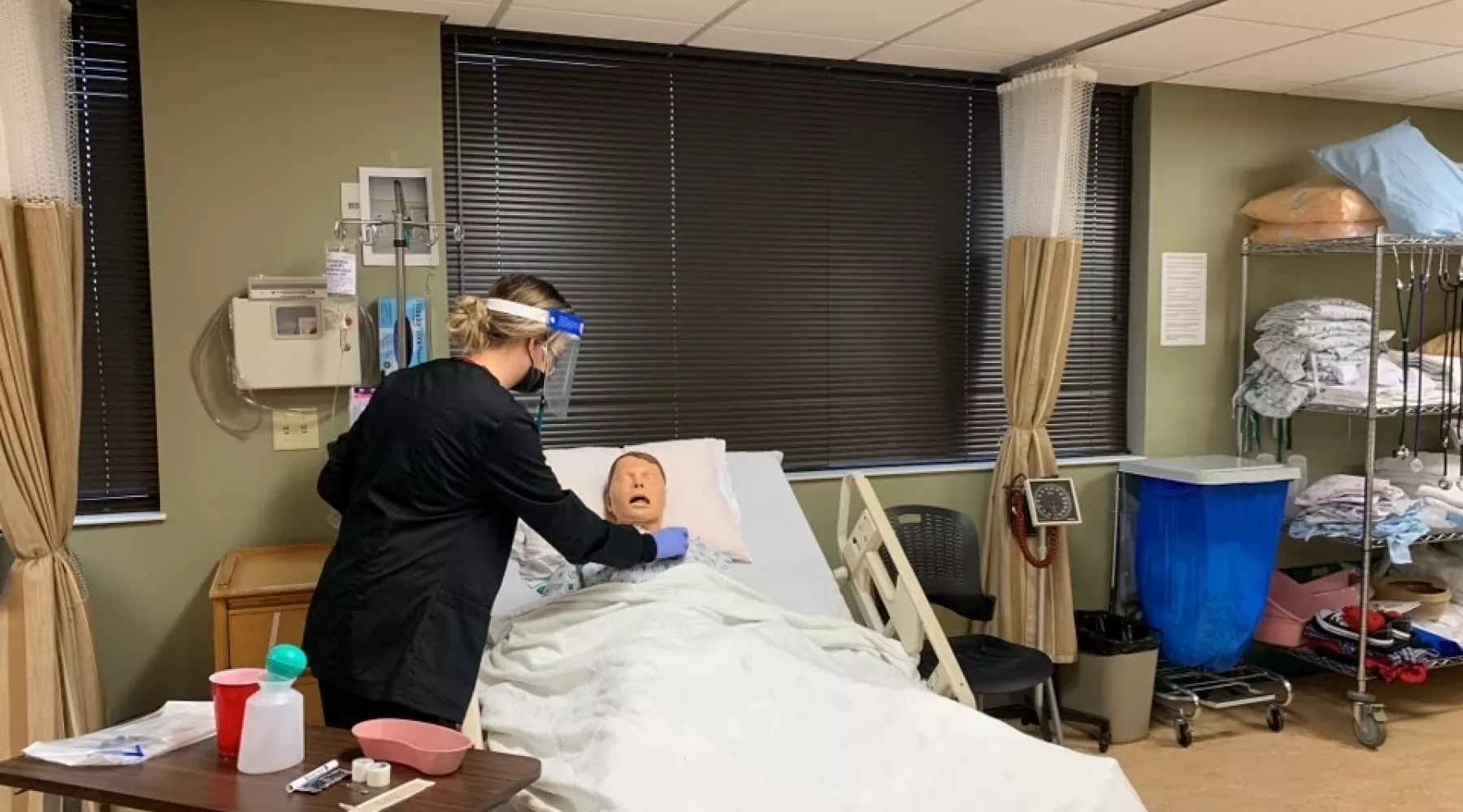 Students participating in a simulation experience in the Clinical Simulation Center at the UofL School of Nursing Louisville Owensboro Extension.