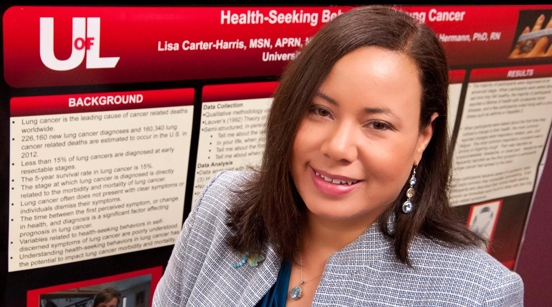 Lisa Carter-Harris standing in front of a research poster.
