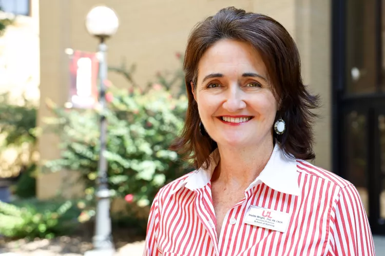 University of Louisville School of Nursing Faculty member, Dr. Imelda Wright poses for a photo on HSC Campus outside on a…