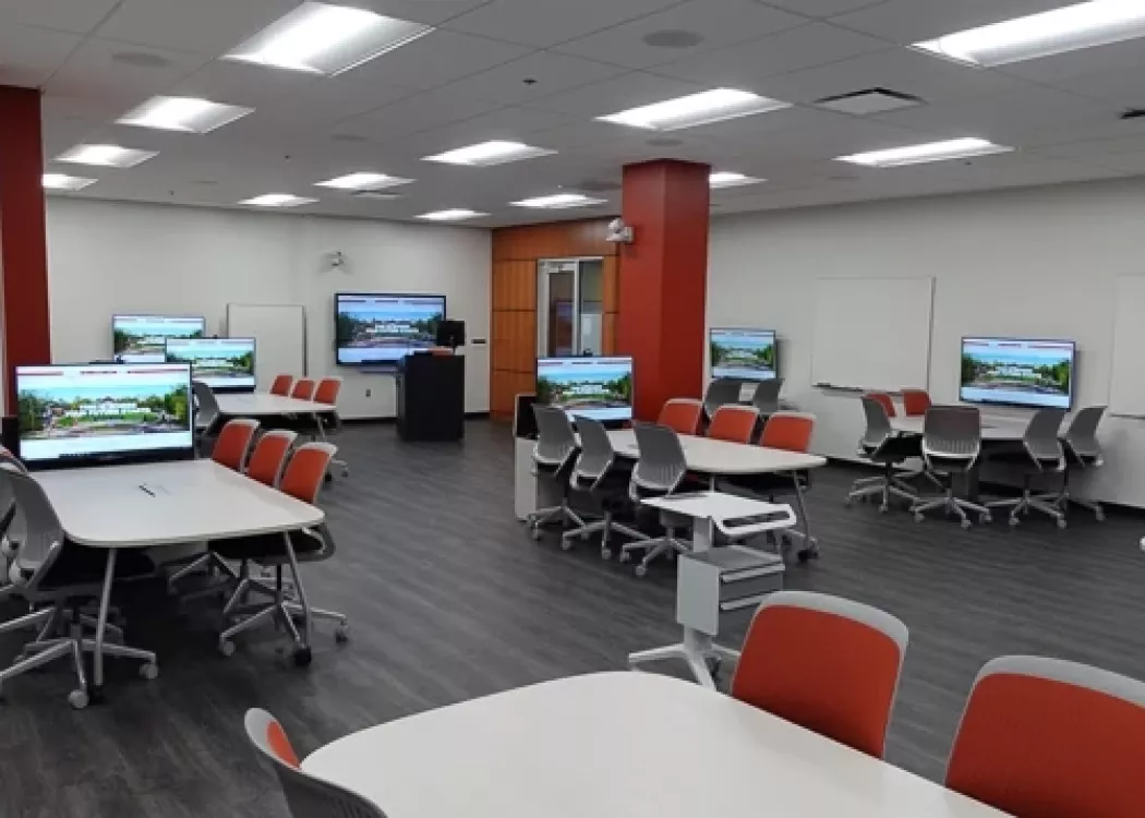An empty active learning classroom (2030) in the Nursing KWing building.