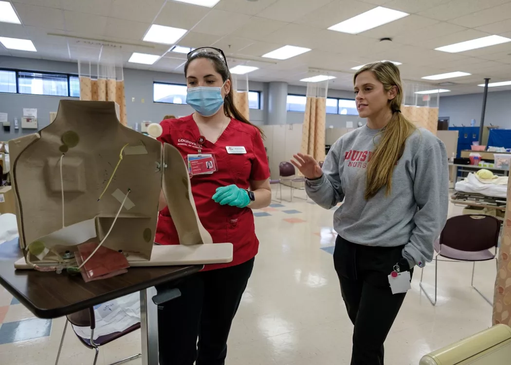 BSN students in skills lab practicing procedures