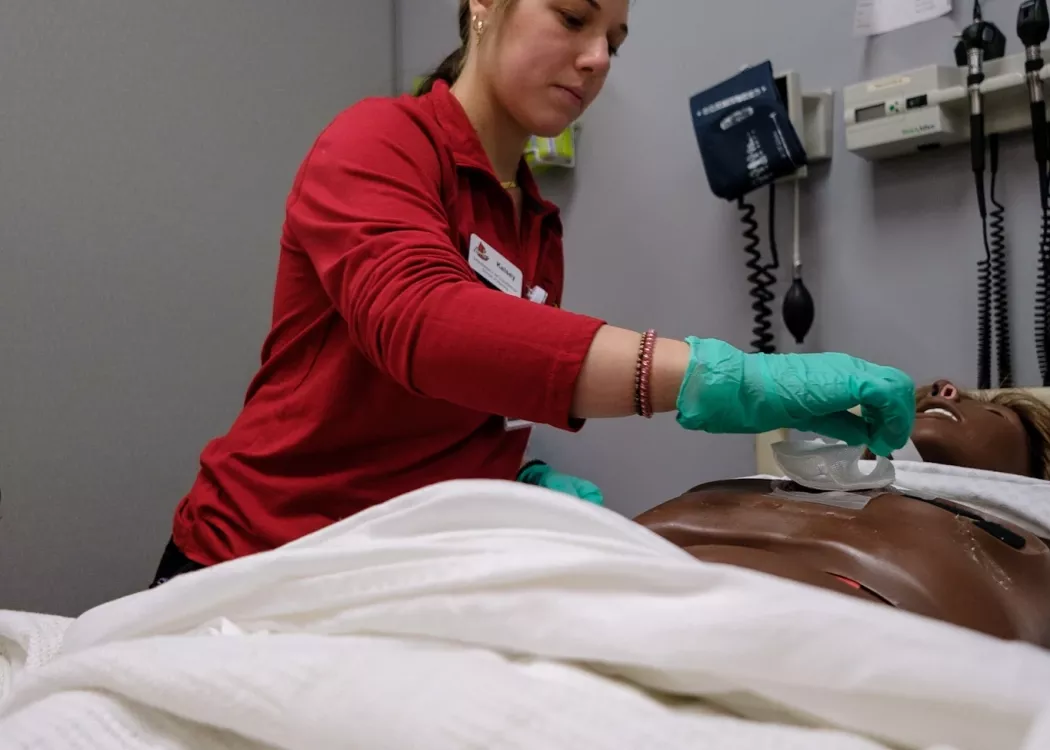 BSN students in skills lab practicing procedures