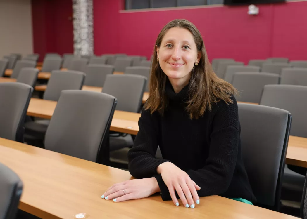 University of Louisville School of Nursing Accelerated BSN Alumni Student, Emmy Wuensch sitting in a classroom in the School of Nursing on HSC Campus.